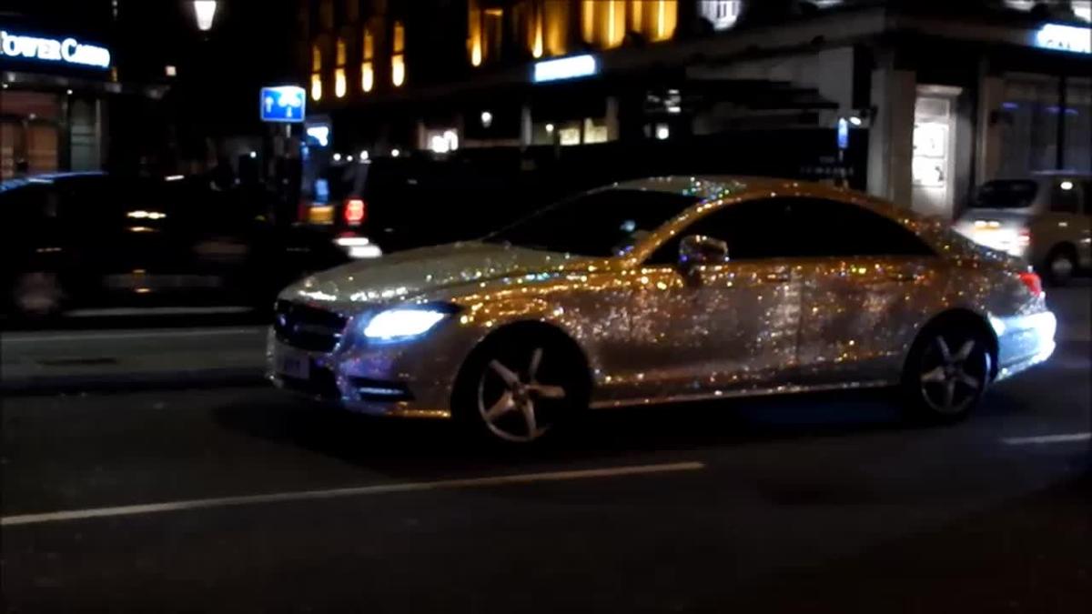 Blinged-up supercars drive through London, UK