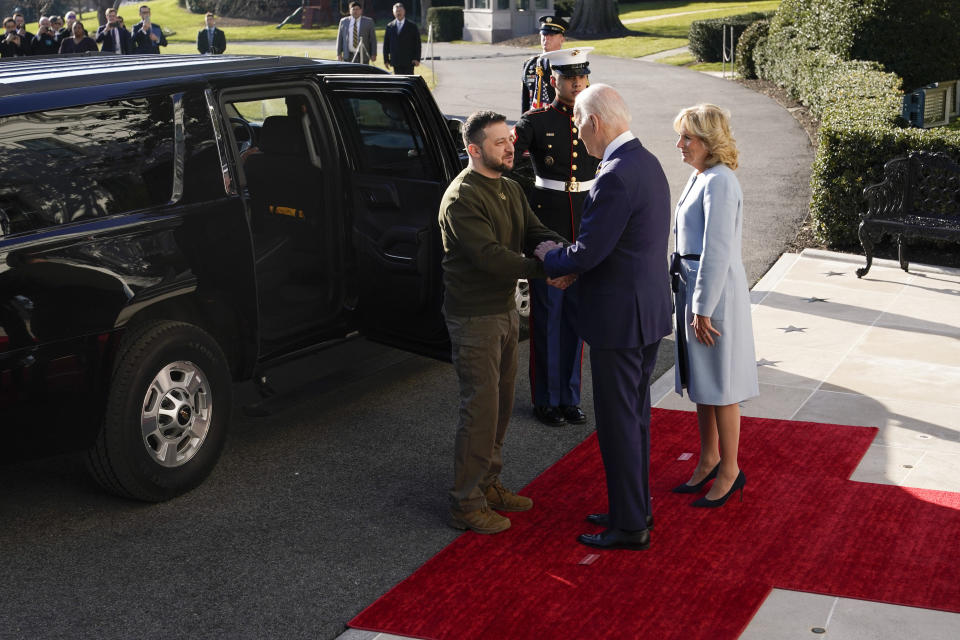 President Joe Biden shakes hands with Ukrainian President Volodymyr Zelenskyy as he welcomes him to the White House, Wednesday, Dec. 21, 2022, in Washington. First lady Jill Biden is at right. (AP Photo/Patrick Semansky)