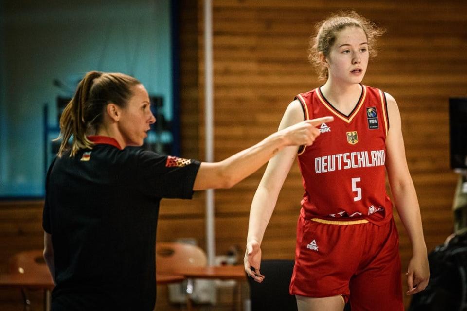Team Germany's Hilke Feldrappe (5) gets direction from coach Sidney Marie Parsons during a game during the 2022 U18 FIBA Women's European Championship on Aug. 8, 2022, at Heraklion University Hall in Heraklion, Greece.