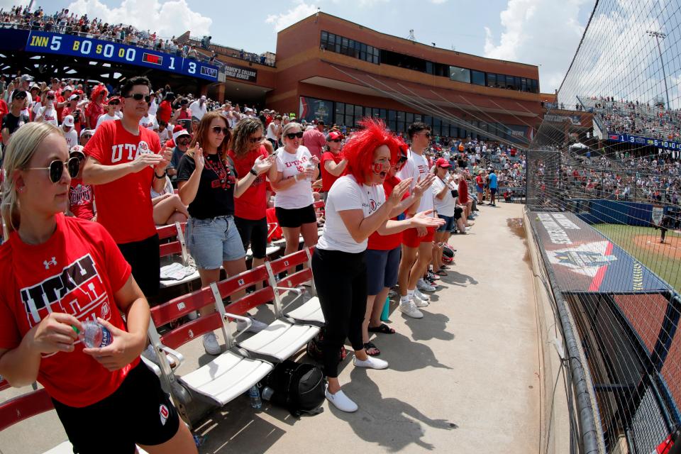 Utah fans cheer during a softball game between Utah and Washington in the Women's College World Series at USA Softball Hall of Fame Stadium in Oklahoma City, Friday, June 2, 2023. Washington won 4-1.