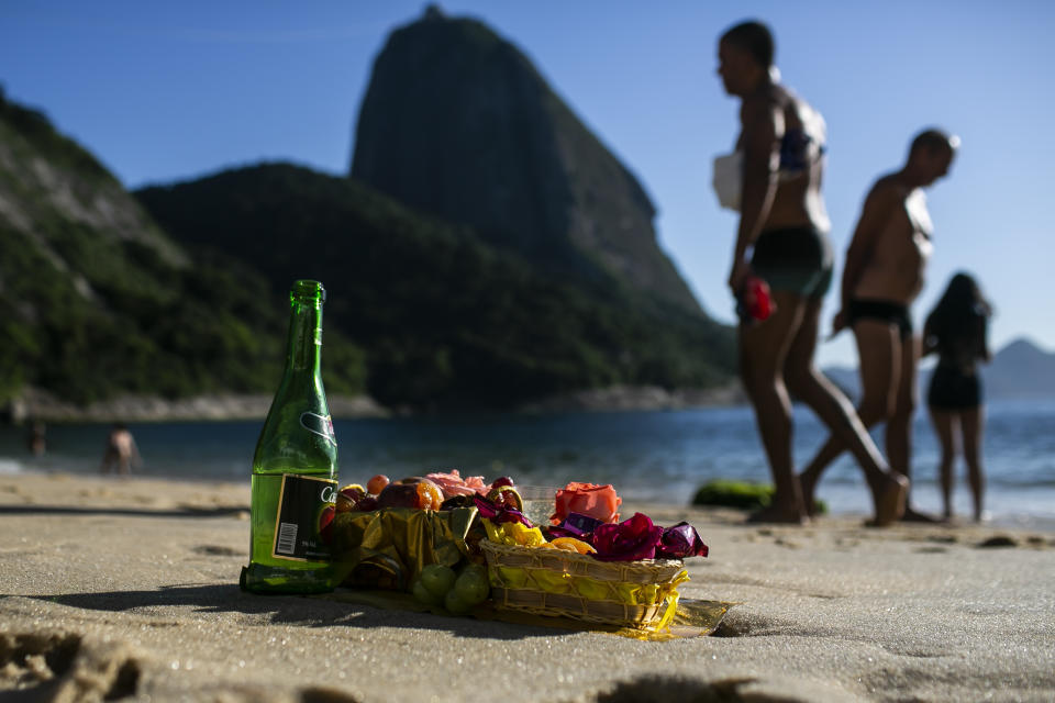 Offerings in honor of the Goddess of the Sea Yemanja sit on Praia Vermelha beach to mark the end of the year in Rio de Janeiro, Brazil, on New Year's Eve, Thursday, Dec. 31, 2020. Beaches will be closed on the night of new years, to help curb the spread of COVID-19. (AP Photo/Bruna Prado)