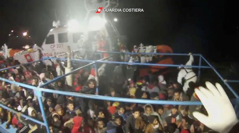 Italian coastguard rescue more than 300 migrants from boat in distress off Lampedusa