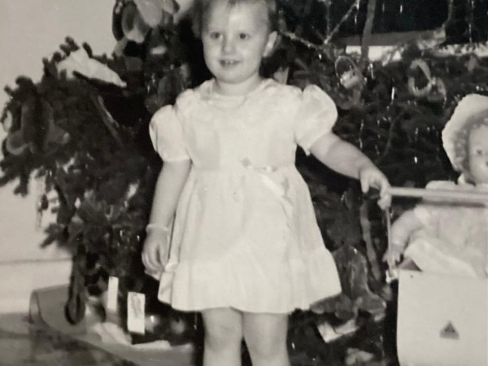 Ruth Green — photographed here in the early '50s — remembers knocking on her neighbours' doors to see Christmas trees as a child in St. John's. (Submitted by Ruth Green - image credit)