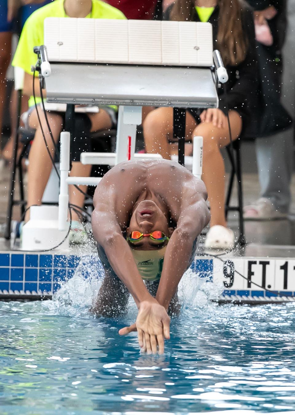 Trinity Catholic’s Xavier Washington starts the 100 yard backstroke during the 2023 FHSAA 1A-2A Swimming and Diving Championship at FAST in Ocala, FL on Saturday, November 4, 2023. [Alan Youngblood/Ocala Star-Banner]