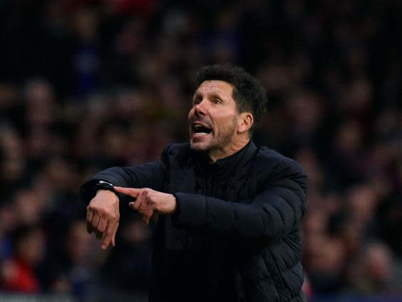 Simeone protests on the touchline against Liverpool (AFP)