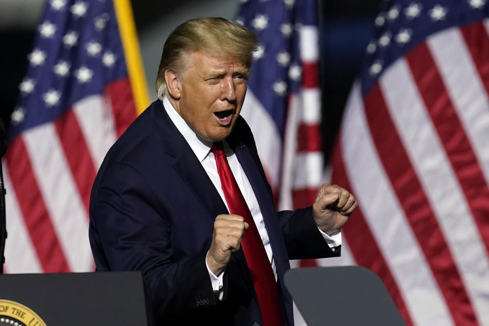 In this Sept. 25, 2020 photo, President Donald Trump does a little dance after speaking at a campaign rally in Newport News, Va. Trump, a man who is famously particular about his appearance, is fully embracing doing a dad dance to the Village People's “YMCA” as the finale to his rallies in the campaign's closing stretch. (AP Photo/Steve Helber)