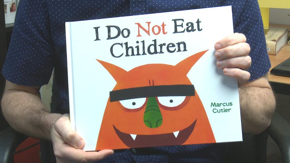 Tecumseh resident and children's book illustrator Marcus Cutler shows his latest work: A book entitled I Do Not Eat Children.