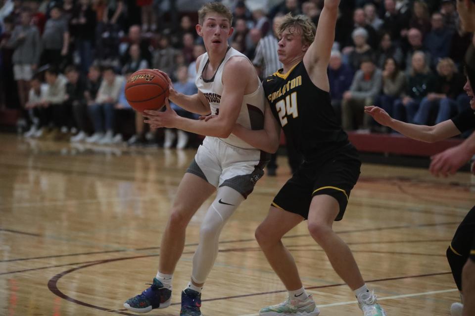 Ethan Russell dribbles past Faulkton's Layne Cotton inside the Aberdeen Christian School on Jan. 18, 2022. Russell finished the game with 19 points.