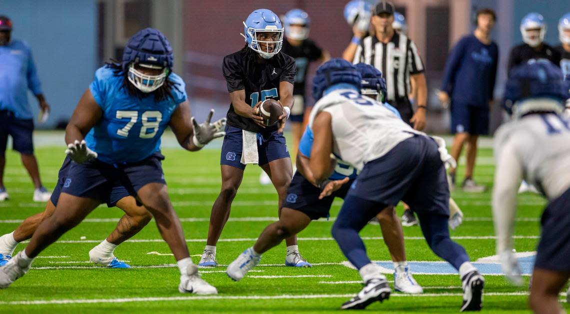 North Carolina quarterback Conner Harrell (15) runs the offense during the Tar Heels’ first practice of the season on Monday, July 29, 2024 in Chapel Hill, N.C.