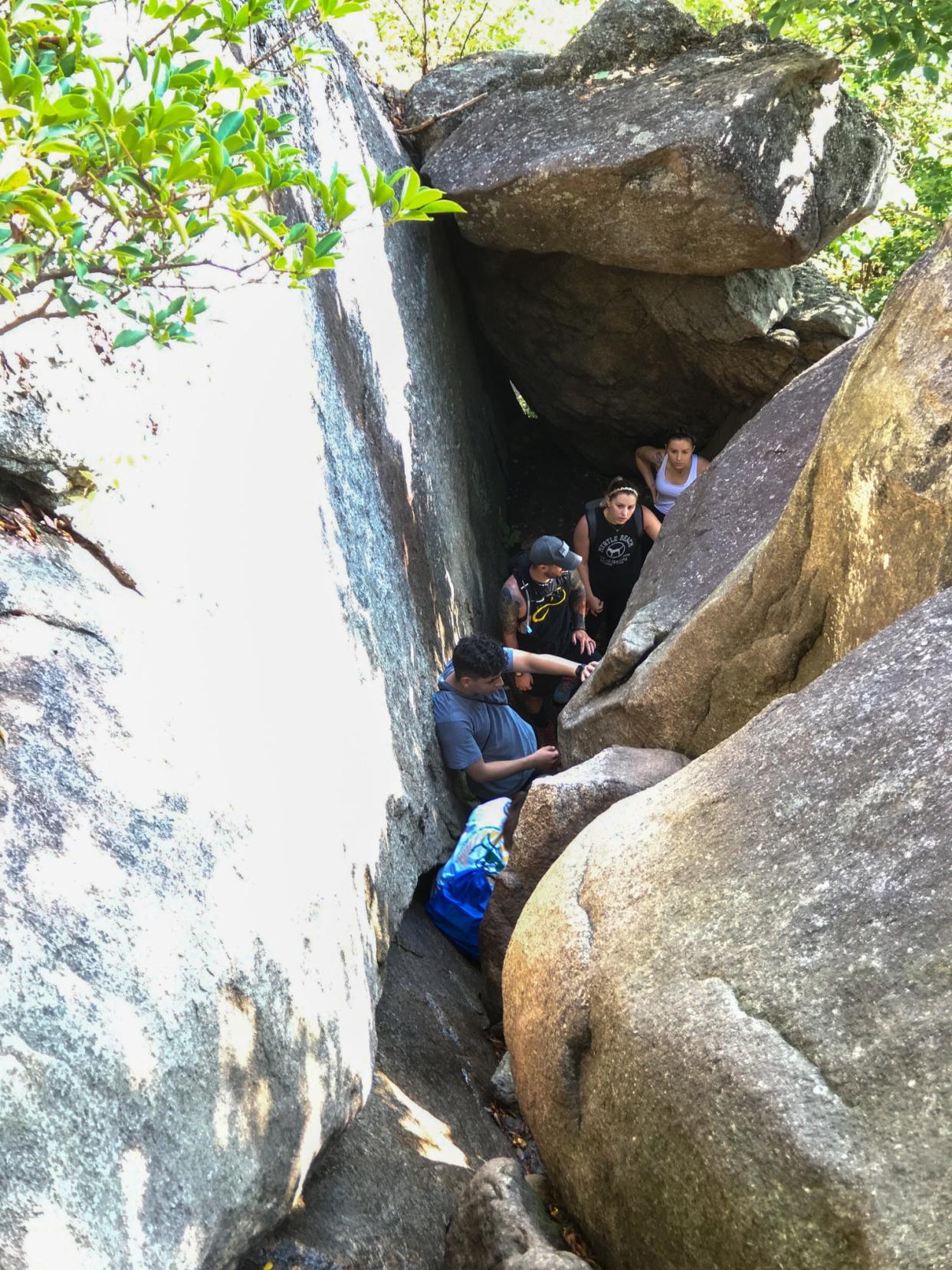 Hikers wait in line at the chute on the rock scramble portion of Old Rag Circuit Trail