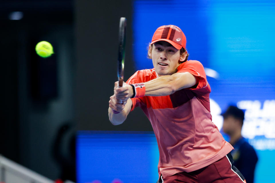 Alex De Minaur hits a backhand.