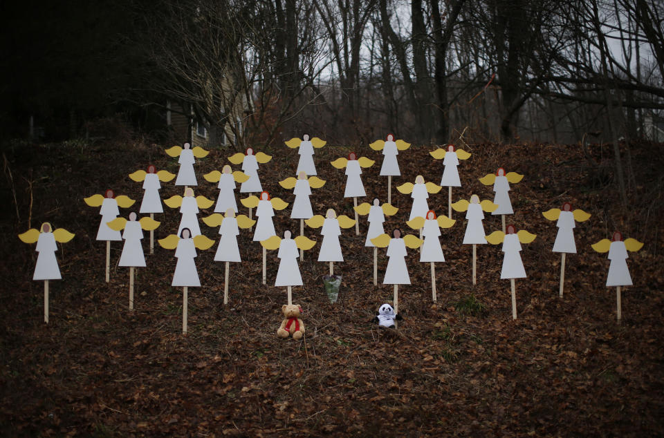 Twenty-seven angel figures were placed beside a road near the Sandy Hook Elementary School in Newtown, Connecticut on Dec. 16, 2012. Two days earlier, a gunman who had killed his mother then massacred 26 people -- including 20 children -- at the school. (Photo: Mike Segar / Reuters)