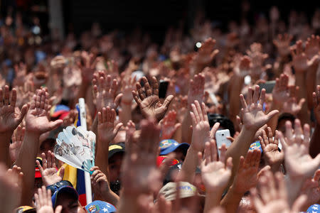 Supporters of Venezuelan opposition leader Juan Guaido, who many nations have recognised as the country's rightful interim ruler, take part in a rally against Venezuelan President Nicolas Maduro's government, in Valencia, Venezuela March 16, 2019. REUTERS/Carlos Jasso