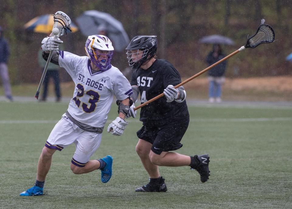 St Rose Colin Westhoven (#23) looks to work in toward goal as Toms River East Alexander Hall (#24) closely guards him. St. Rose Boys Lacrosse defeats Toms River East 8-6 in Tinton Falls on May 6, 2022.