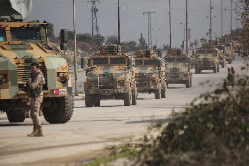 FILE - A Turkish military convoy moves in Idlib province, Syria, on Feb. 22, 2020. For years, Syria’s civil war has been a largely frozen conflict, the country effectively carved up into areas controlled by the Damascus government of President Bashar Assad, various opposition groups and Syrian Kurdish forces. But as the conflict entered its 14th year on Friday, March 15, 2024 observers say violence has been on the rise again while the world’s attention is mostly focused on other crises, such as Russia’s onslaught on Ukraine and the Israel-Hamas war in Gaza. (AP Photo/Ghaith Alsayed, File)