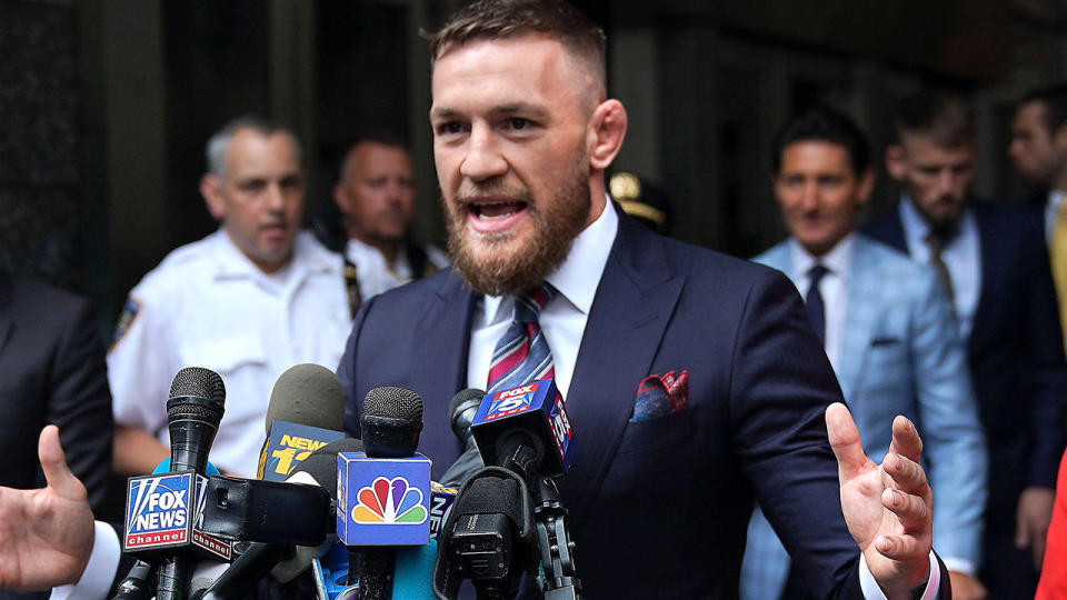 Conor McGregor talks to the press after he pleaded guilty to a single violation of disorderly conduct, in Brooklyn Criminal Court on July 26, 2018. (Photo by TIMOTHY A. CLARY / AFP)