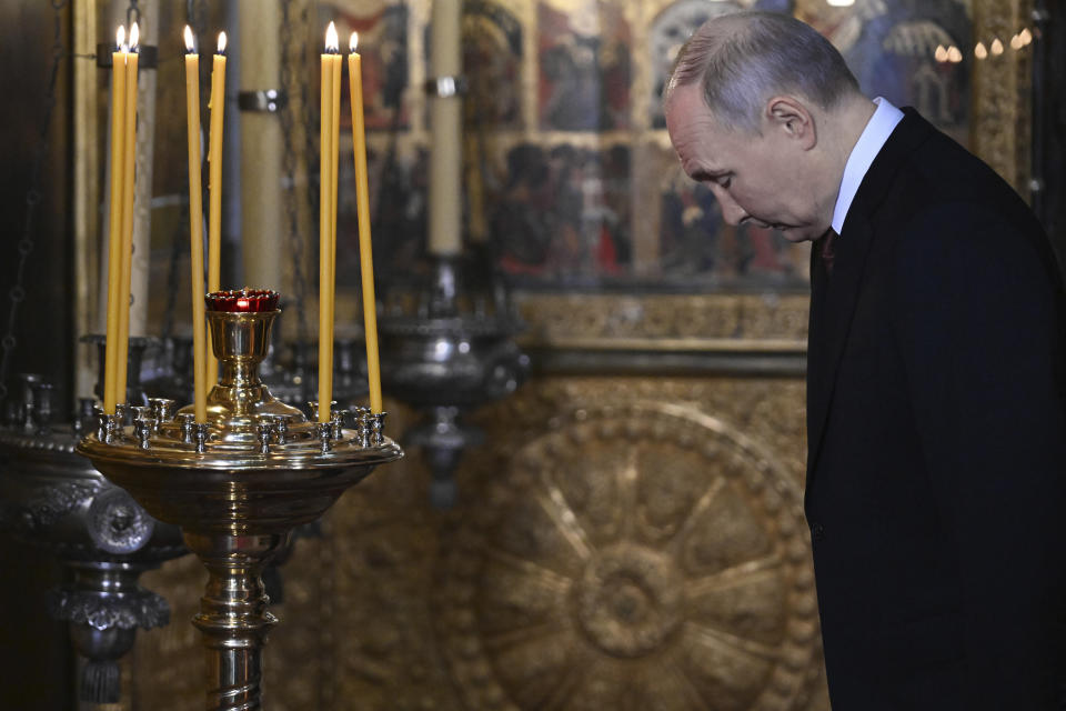 Russian President Vladimir Putin attends a prayer service following an inauguration ceremony at the Kremlin's Annunciation Cathedral in Moscow, Russia, Tuesday, May 7, 2024. (Alexey Maishev, Sputnik, Kremlin Pool Photo via AP)