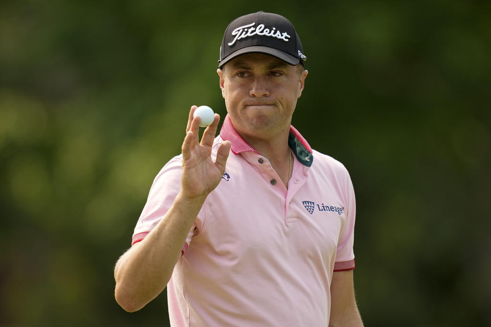 Justin Thomas waves after making a putt on the 14th hole during the final round of the PGA Championship golf tournament at Southern Hills Country Club, Sunday, May 22, 2022, in Tulsa, Okla. (AP Photo/Eric Gay)