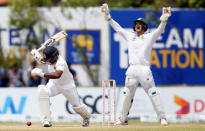 Cricket - Sri Lanka v South Africa - First Test Match - Galle, Sri Lanka - July 14, 2018 - South Africa's wicketkeeper Quinton de Kock (R) appeals for a successful LBW wicket for Sri Lanka's Rangana Herath. REUTERS/Dinuka Liyanawatte