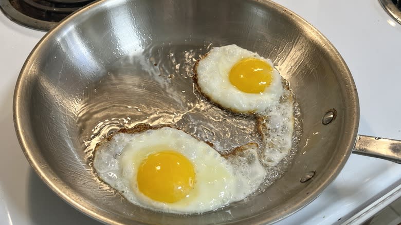 eggs frying in pan