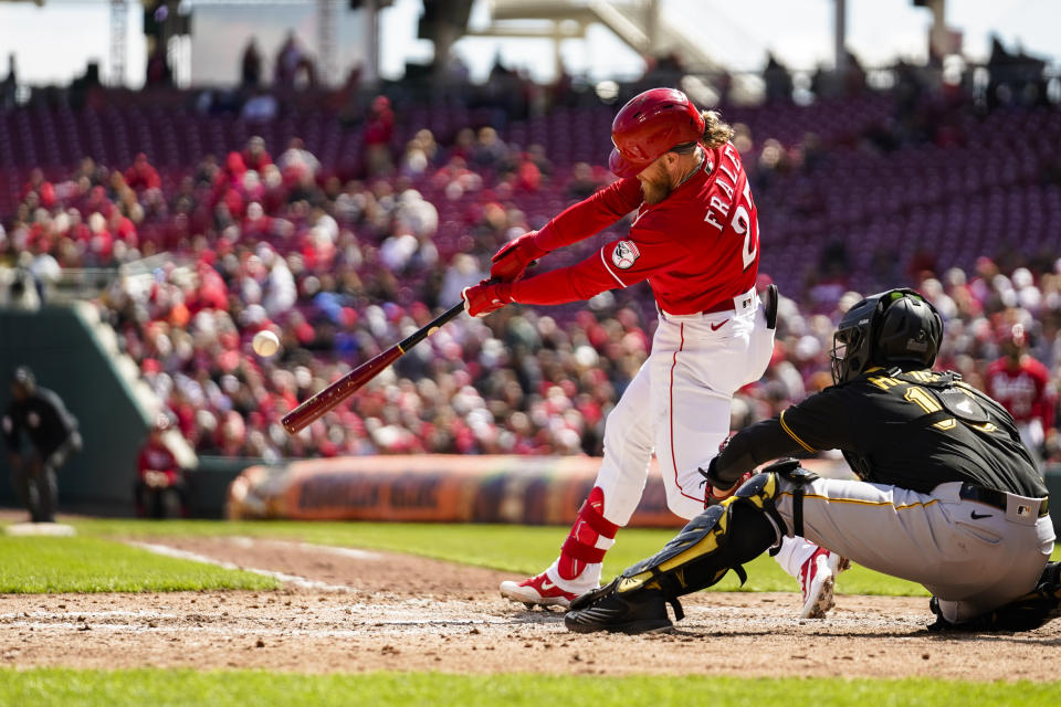 Cincinnati Reds' Jake Fraley (27) hits a double against the Pittsburgh Pirates in the fifth inning of a baseball game in Cincinnati, Sunday, April 2, 2023. (AP Photo/Jeff Dean)