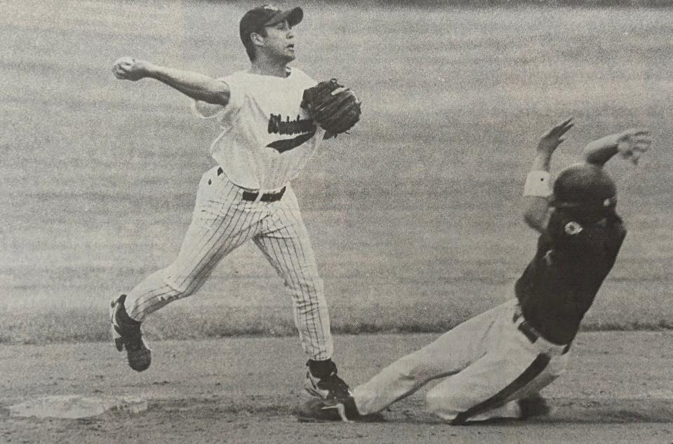 Watertown Post 17 shortstop Lucas Van Gilder attempts to avoid Sioux Falls East base runner Lee Terveen on a double play attempt in the championship game of the 1997 state Class A American Legion Baseball tournament at Pierre. Sioux Falls East won 5-4.