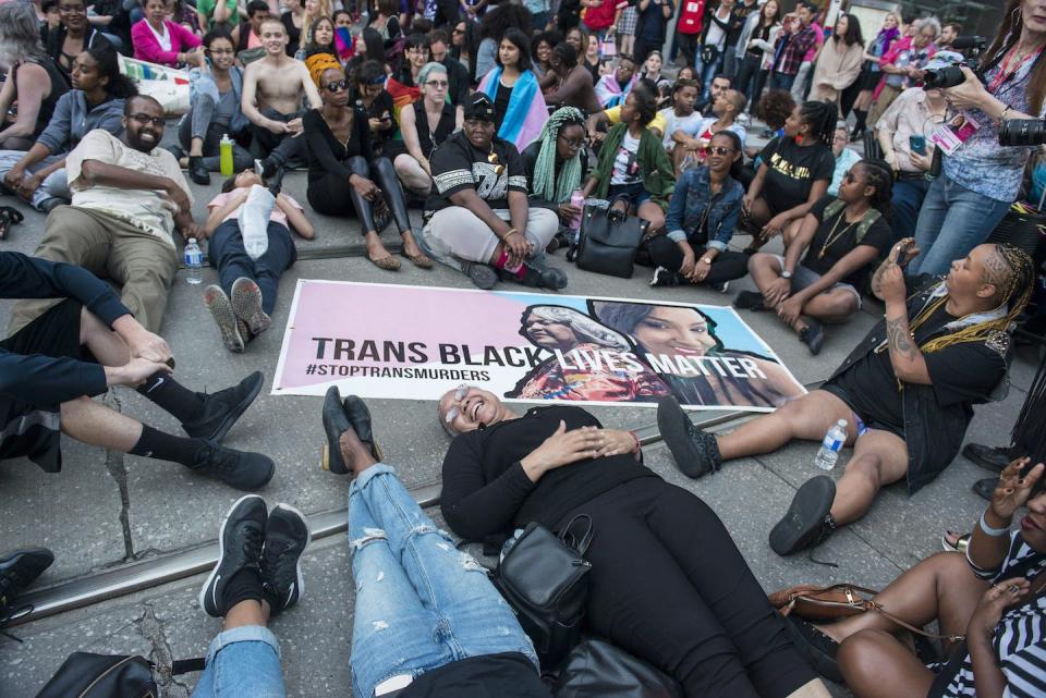 Black Lives Matter activists organize a sit-in at Yonge Street and College Street during the Trans Pride March, in Toronto, 2016. (THE CANADIAN PRESS/Eduardo Lima)