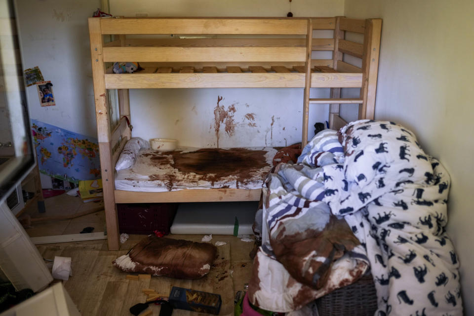 Blood is seen splattered in a child's room following a massive Hamas militant attack in Kibbutz Nir Oz, Israel, Thursday, Oct. 19, 2023. Nir Oz is one of more than 20 towns and villages in southern Israel that were ambushed in the sweeping assault by Hamas on Oct. 7. The kibbutz on a low rise overlooking the border fence with Gaza suffered a particularly harsh toll with about 100 of Nir Oz's 400 people dead or missing. (AP Photo/Francisco Seco)