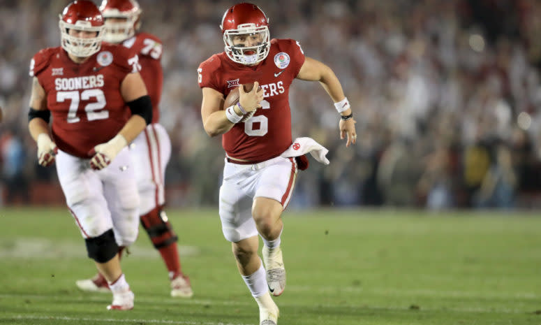 Baker Mayfield runs the ball against Georgia.