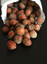 <div class="caption-credit"> Photo by: istock.com</div><b>Hazelnuts: More Than Just Coffee</b> <br> Flavoring An all-around healthy nut, hazelnuts are notable for their high levels of monounsaturated fats, which can improve cardiovascular health and help to manage type 2 diabetes, according to Bauer. They're also rich in the antioxidant vitamin E, which may prevent cataracts and macular degeneration, maintain healthy skin, and reduce risk of dementia. <br> Serving info: About 21 nuts = 180 cals, 17 grams fat <br> <p> · <a rel="nofollow noopener" href="http://wp.me/p1rIBL-l5" target="_blank" data-ylk="slk:High Fiber Diets;elm:context_link;itc:0;sec:content-canvas" class="link ">High Fiber Diets</a> </p> <p> · <a rel="nofollow noopener" href="http://wp.me/p1rIBL-jG" target="_blank" data-ylk="slk:Healthy Foods That Kids Will Enjoy Eating;elm:context_link;itc:0;sec:content-canvas" class="link ">Healthy Foods That Kids Will Enjoy Eating</a> </p> <ul> <li> <a rel="nofollow noopener" href="http://wp.me/p1rIBL-hW" target="_blank" data-ylk="slk:Healthy Cooking is a Must for Families;elm:context_link;itc:0;sec:content-canvas" class="link ">Healthy Cooking is a Must for Families</a> </li> </ul> <br>