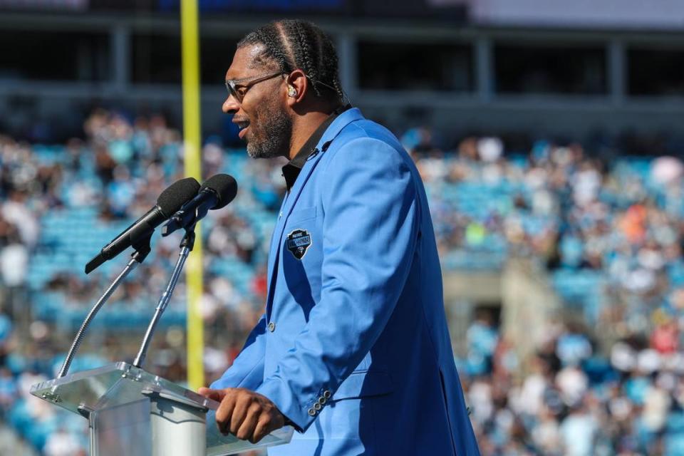 Panthers legend Julius Peppers delivers remarks at his Hall of Honor induction ceremony during halftime of Texans at Panthers at Bank of America Stadium on Sunday, October 29, 2023. Peppers will now trade that blue jacket for a gold one, symbolic of his enshrinement into the Pro Football Hall of Fame in August. Melissa Melvin-Rodriguez/mrodriguez@charlotteobserver.com