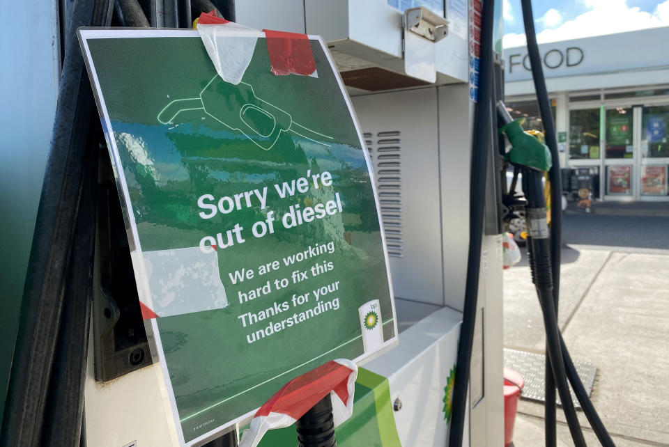 WEYMOUTH, ENGLAND - SEPTEMBER 24: A sign reading 'Sorry we're out of diesel' is seen at a BP petrol station on September 24, 2021 in Weymouth, England. BP and Esso have announced that its ability to transport fuel from refineries to its branded petrol station forecourts is being impacted by the ongoing shortage of HGV drivers and as a result, it will be rationing deliveries to ensure continuity of supply. (Photo by Finnbarr Webster/Getty Images)