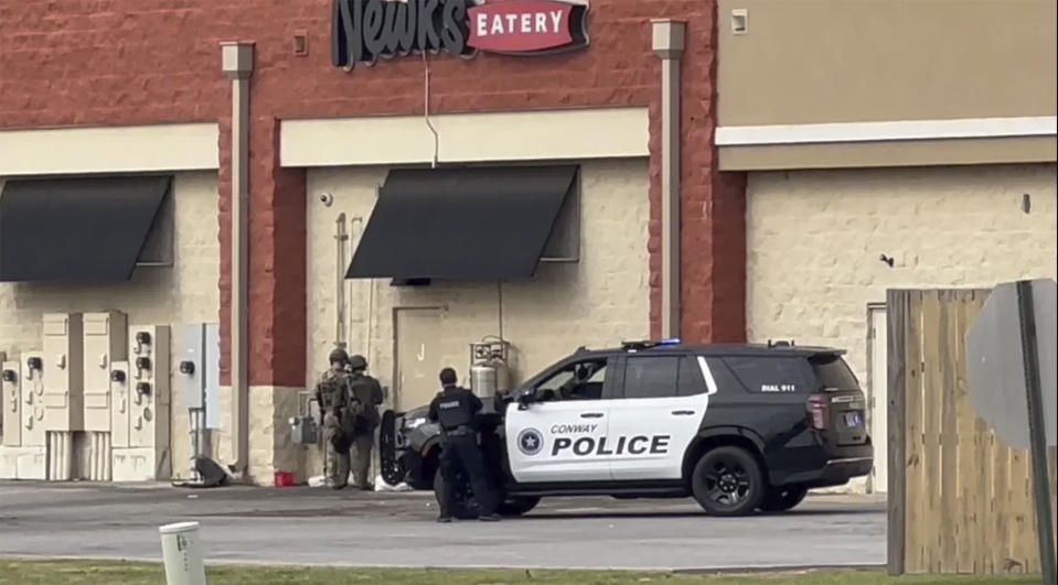 Police respond to an incident in the Lewis Crossing Shopping Center on Saturday, April 6, 2024 in Conway, Ark. Shots were fired, although it wasn’t immediately clear where the shots came from. Arkansas State Police were investigating the incident as an “officer-involved shooting,” KATV-TV reported. (KATV via AP)