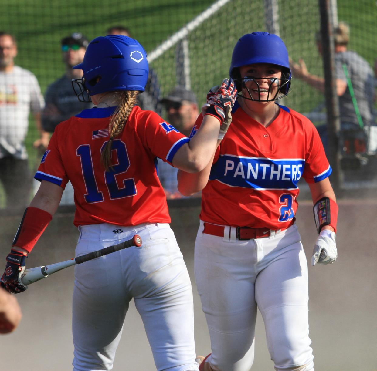 Licking Valley's Abbe McNabb, right, celebrates with Hailey Small after scoring against Newark Catholic on Tuesday.