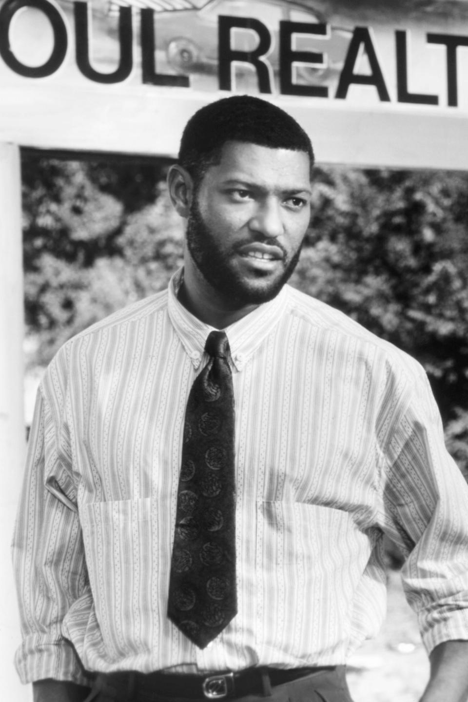 Laurence Fishburne wearing a striped shirt and patterned tie