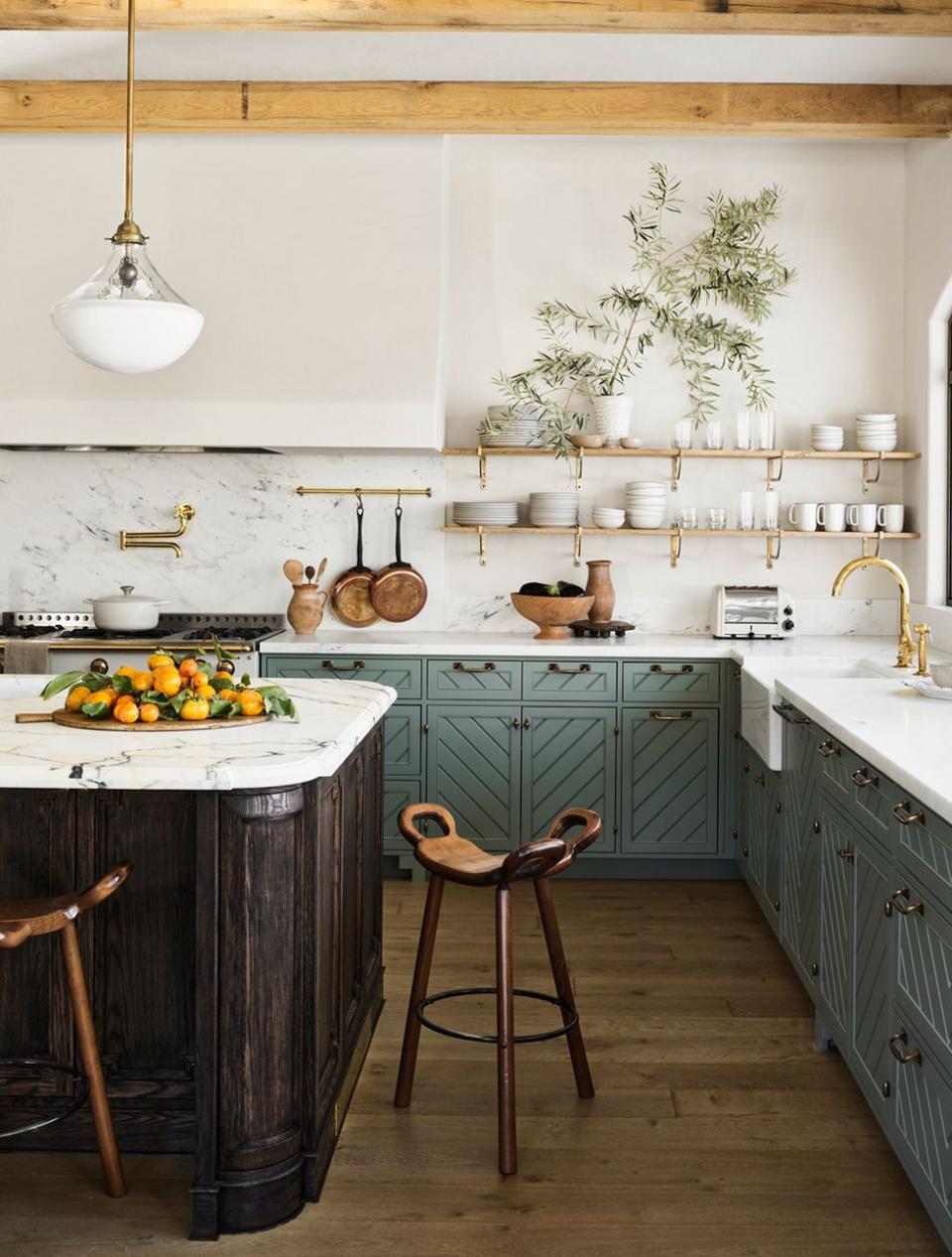 a kitchen with a table and chairs