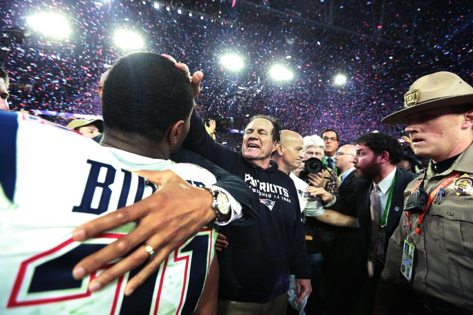 Bill Belichick celebrates with Malcolm Butler after beating the Seattle Seahawks in the Super Bowl in 2015.
