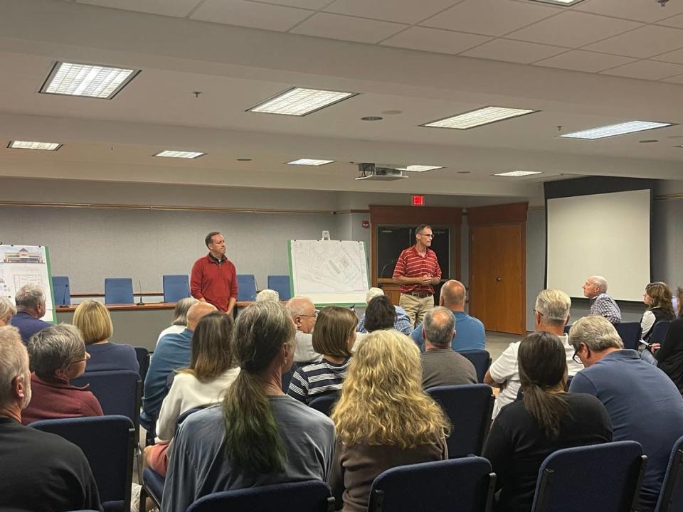 Mike Spiegel, real estate project manager at Wawa, and Tony Fruchtl, PennTerra engineer, listen to questions and concerns about the proposed Wawa at 169 W. Aaron Drive, State College during a meeting Sept. 20.