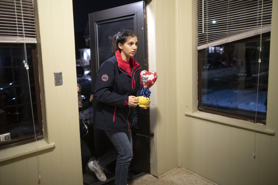 In this Dec. 3, 2019, photo, Jana Hafar arrives home in Bloomfield, N.J. Jana had been forced by President Donald Trump's travel ban to stay behind in Syria for months while her father, his wife and son Karim started rebuilding their lives in Bloomfield, N.J., with no clear idea of when the family would be together again. (AP Photo/Mary Altaffer)