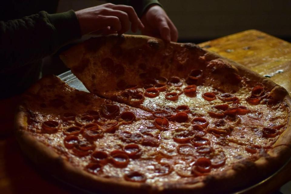 Camp Colvos Brewery + Pizza Co. serves beer from Vashon Island and New York-style pies at the Brewery Blocks in Tacoma, Washington. Kristine Sherred/ksherred@thenewstribune.com