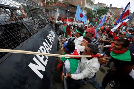 Supporters of Federal Alliance, a coalition of Madhes-based parties and other ethnic political parties and organizations, protest against the constitution near Singha Durbar office complex that houses the Prime Minister's office and other ministries in Kathmandu, Nepal, May 15, 2016. REUTERS/Navesh Chitrakar