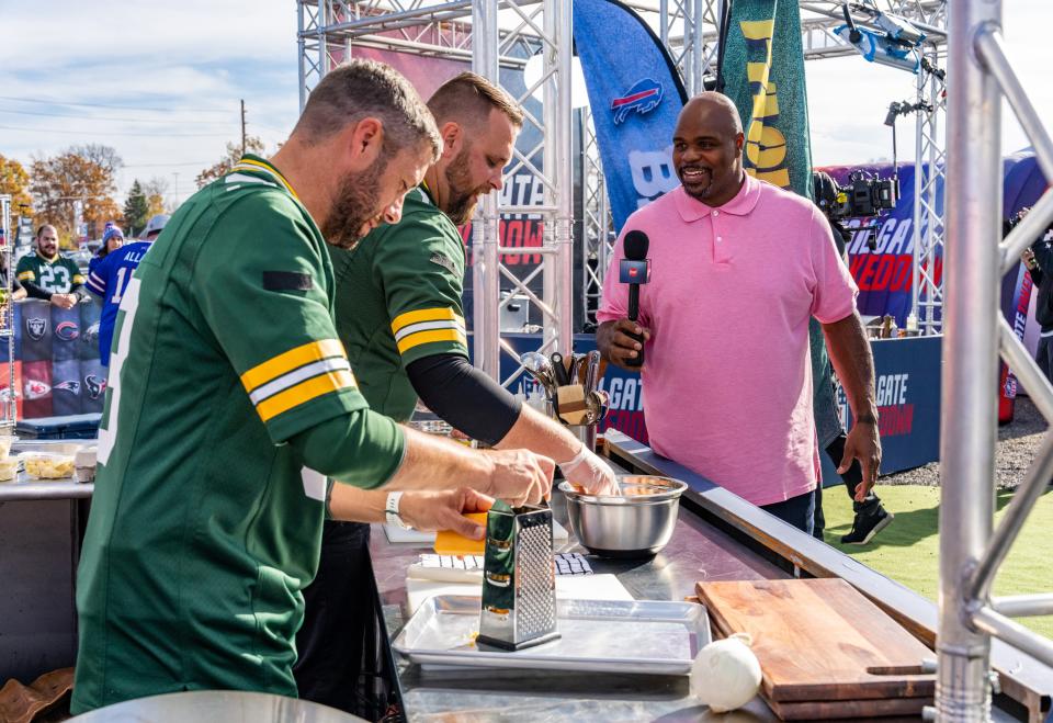 Chris Schemm of Lawrence, right, and Tyler Foti, represent the Green Bay Packers in an episode of "NFL Tailgate Takedown" on the Food Network, hosted by Vince Wilfork.