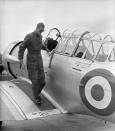 <p>Philip went all <em>Top Gun</em> in overalls and aviator shades while training for his 'wings' in May 1953. Photo: Getty Images.</p> 