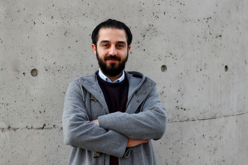 Syrian migrant Tareq Alaows poses during an interview with Reuters in Berlin