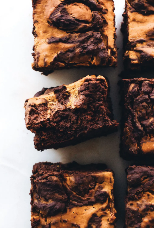 <p>Feasting on Fruit</p><p>Fudgy oat flour brownie base marbled with spiced swirls of pumpkin on top. A gluten-free, oil-free, decadent fall dessert! </p><p><strong>Get the recipe: <em><a href="https://feastingonfruit.com/vegan-pumpkin-swirl-brownies/" rel="nofollow noopener" target="_blank" data-ylk="slk:Vegan Pumpkin Swirl Brownies;elm:context_link;itc:0;sec:content-canvas" class="link rapid-noclick-resp">Vegan Pumpkin Swirl Brownies</a></em></strong></p>