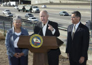 FILE - In this Oct. 26, 2018, file photo, California Gov. Jerry Brown, center, stands between California Air Resources Board Chair Mary Nichols and Attorney General Xavier Becerra in Sacramento, Calif. Nichols' term leading the California ARB ends in December 2020. She's held the role since 2007 after an earlier stint as chair in the early 1980s. (AP Photo/Rich Pedroncelli, File)