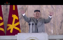 In this image made from video broadcasted by North Korea's KRT on Saturday, Oct. 10, 2020, North Korean leader Kim Jong Un waves during a ceremony to celebrate the 75th anniversary of the country’s ruling party in Pyongyang.(KRT via AP)