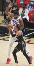 Atlanta Hawks guard Trae Young, bottom, draws a foul from Philadelphia 76ers center Joel Embiid, top, on his way to the basket during Game 4 of a second-round NBA basketball playoff series on Monday, June 14, 2021, in Atlanta. (Curtis Compton/Atlanta Journal-Constitution via AP)