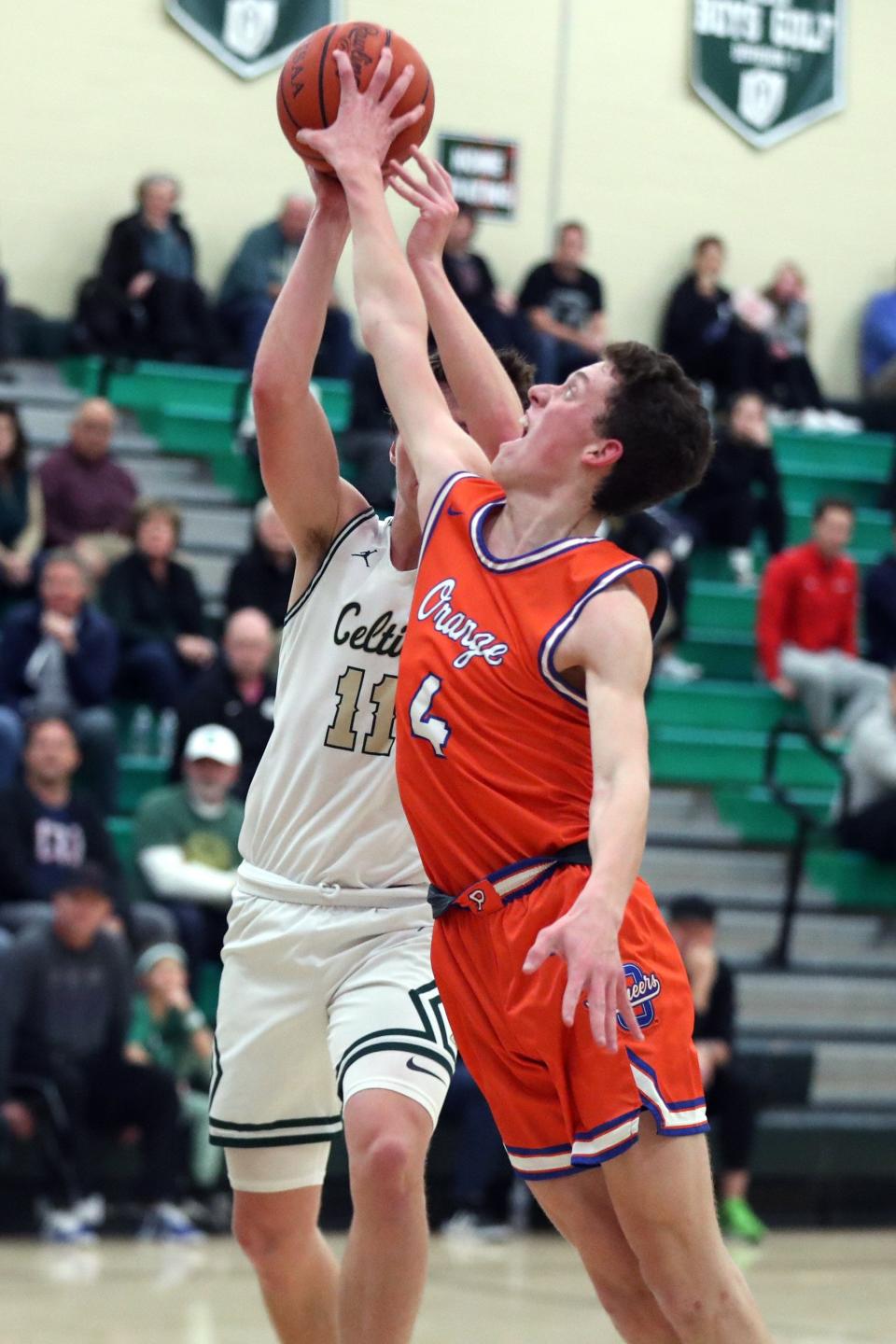 Olentangy Orange's Nick Chapman blocks a shot from Dublin Jerome's Luke Kuhlman during a game Dec. 6.