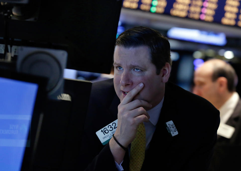 Specialist Gregg Maloney works on the floor of the New York Stock Exchange, Monday, March 3, 2014. Global stock markets are down sharply on tensions over Russia's military advance into Ukraine and the threat of sanctions by Western governments. (AP Photo/Richard Drew)